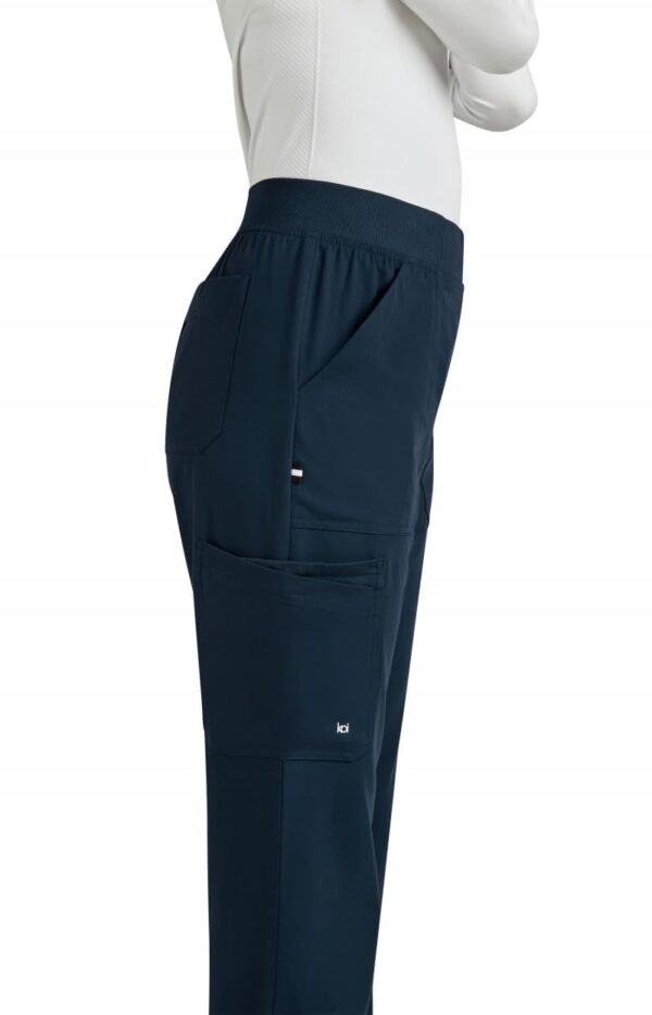 KOI Next Gen Jump Start Women's 7-Pocket Boot Cut Scrub Pant in Navy product image