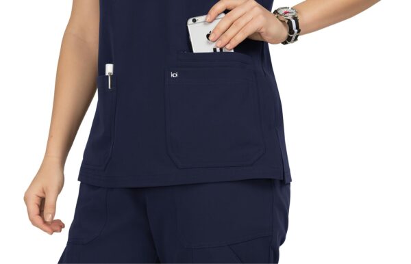 KOI Next Gen Women's 3 Pocket Hustle and Heart V-Neck Scrub Top, 4-Way Stretch in Navy product image