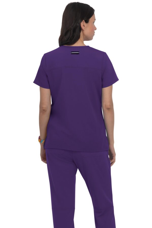 KOI Next Gen Women's 3 Pocket Hustle and Heart V-Neck Scrub Top, 4-Way Stretch in Eggplant product image