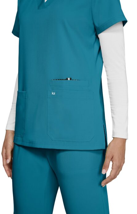 KOI Next Gen Women's 3 Pocket Hustle and Heart V-Neck Scrub Top, 4-Way Stretch in Teal product image