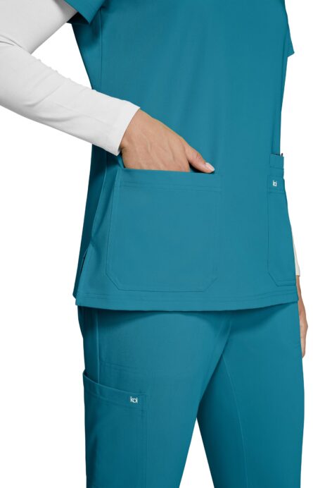 KOI Next Gen Women's 3 Pocket Hustle and Heart V-Neck Scrub Top, 4-Way Stretch in Teal product image