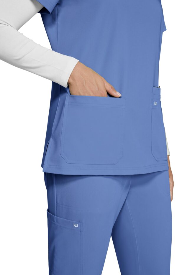 KOI Next Gen Women's 3 Pocket Hustle and Heart V-Neck Scrub Top, 4-Way Stretch in True Ceil product image